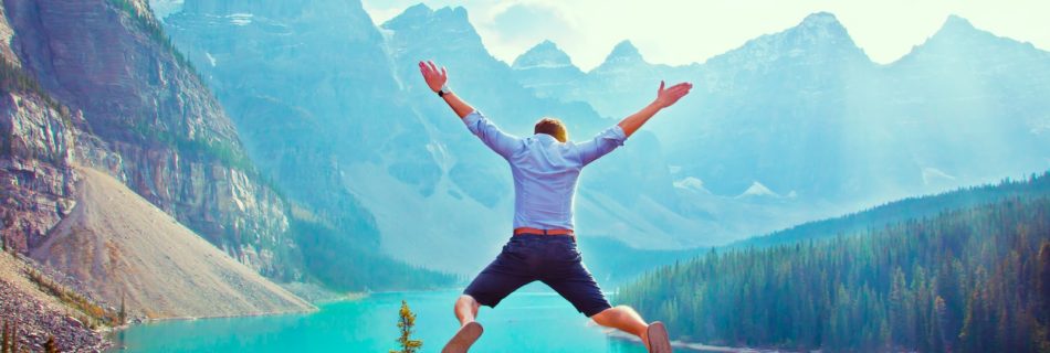 photo of man about to jump from cliff